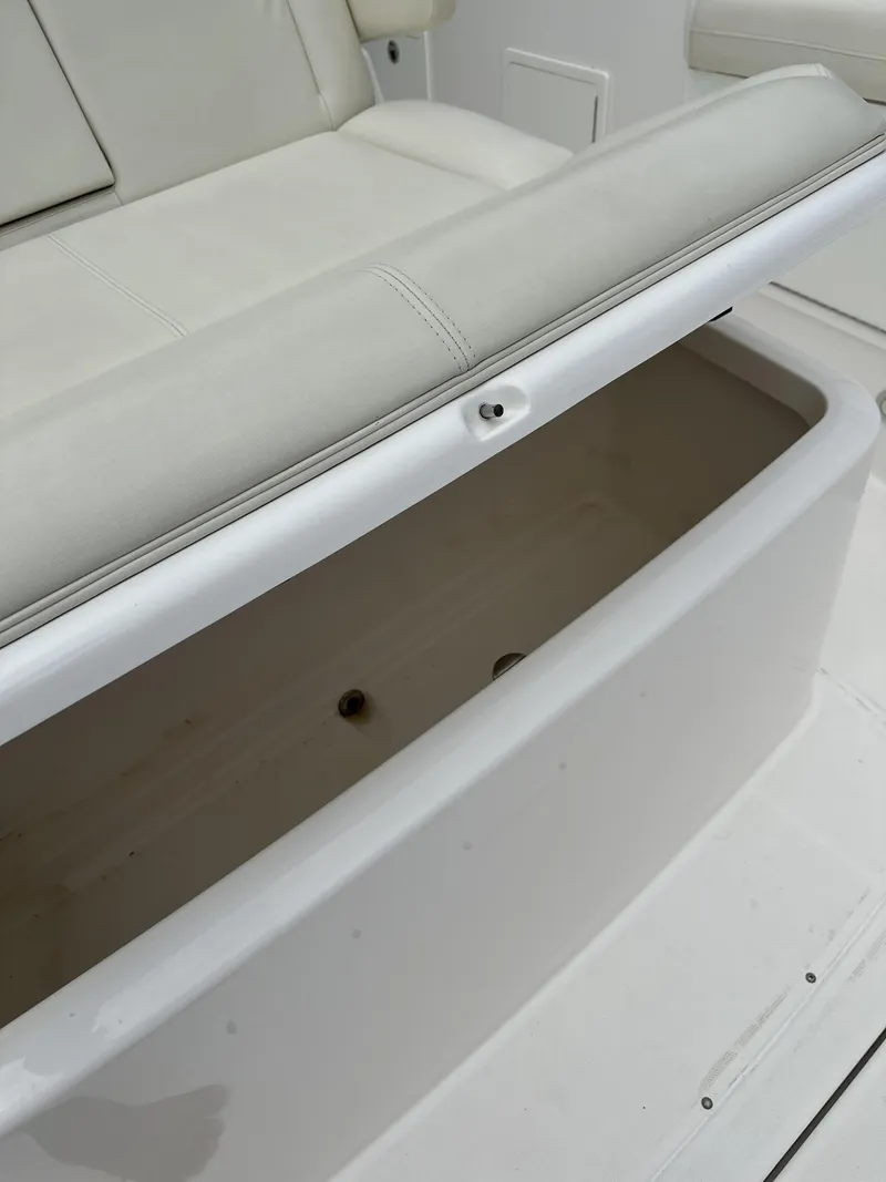 Slide: The Image of Open storage compartment on 2017 Everglades 435 Center Console boat. - 29
