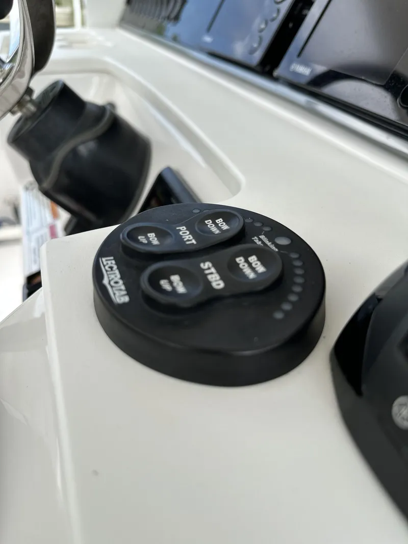 Slide: The Image of Close-up of 2017 Everglades 435 Center Console boat controls and dashboard. - 39