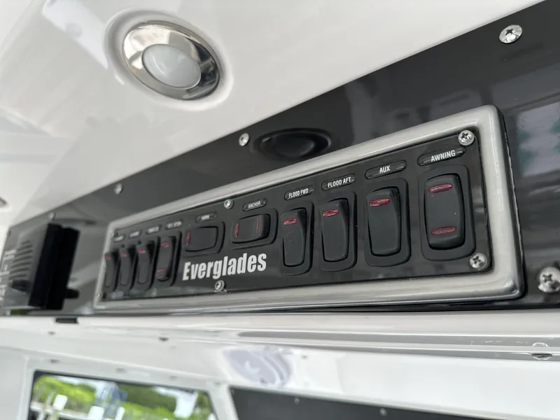 Slide: The Image of Control panel of 2017 Everglades 435 Center Console boat with labeled switches. - 40