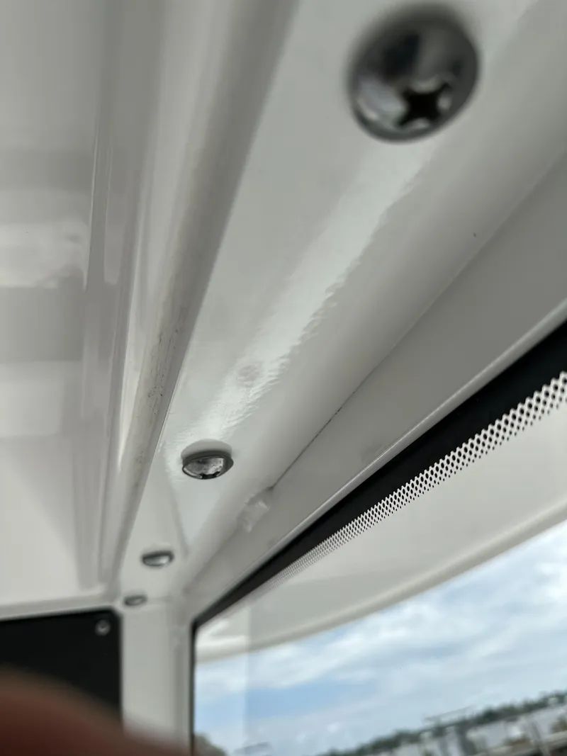 Slide: The Image of Close-up of Everglades 435 Center Console 2017 boat interior screws and window. - 43