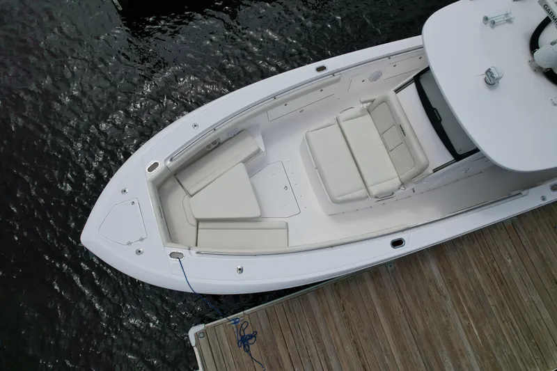 Slide: The Image of Overhead view of 2017 Everglades 435 Center Console boat docked by wooden pier. - 5