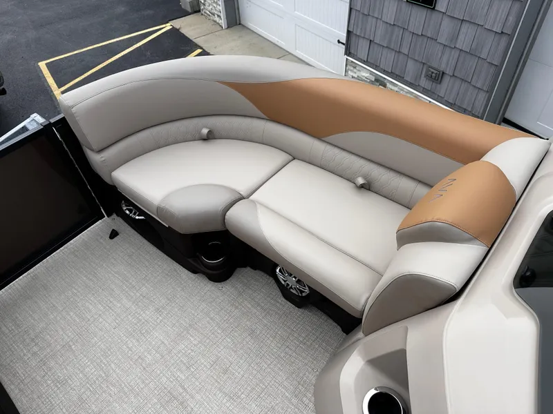 Slide: The Image of 2025 Avalon 2385 LSZ Quad Lounger interior with beige and tan seating. - 11
