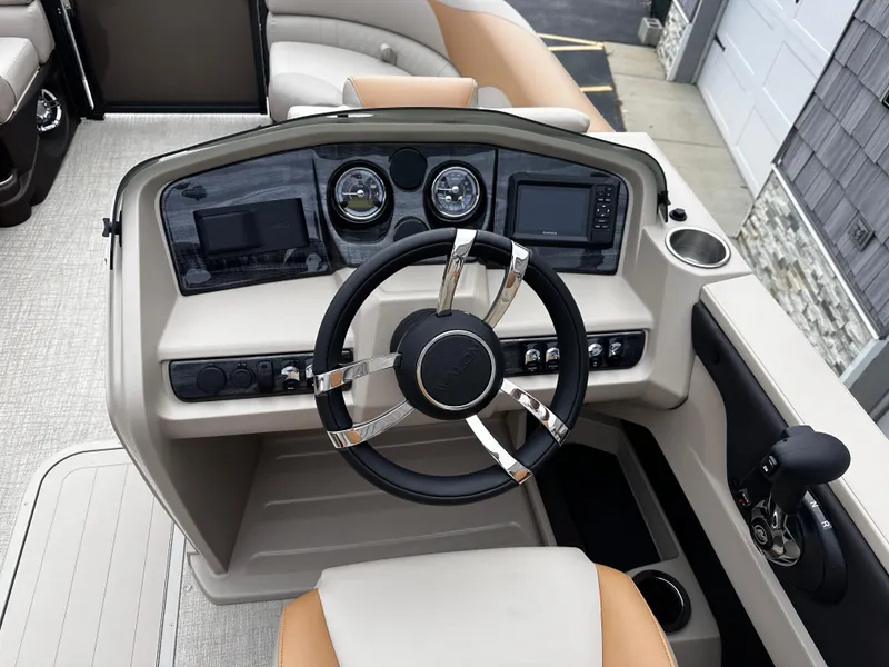 Slide: The Image of 2025 Avalon 2385 LSZ Quad Lounger dashboard with steering wheel and controls. - 15
