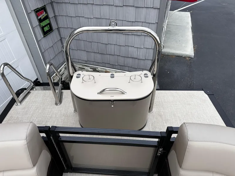 Slide: The Image of 2025 Avalon 2385 LSZ Quad Lounger boat interior with seating and storage. - 19