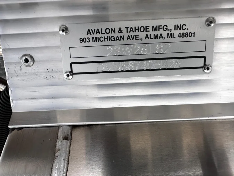 Slide: The Image of Avalon 2385 LSZ Quad Lounger, Tri Toon, 2025 model, manufacturer plate detail. - 23