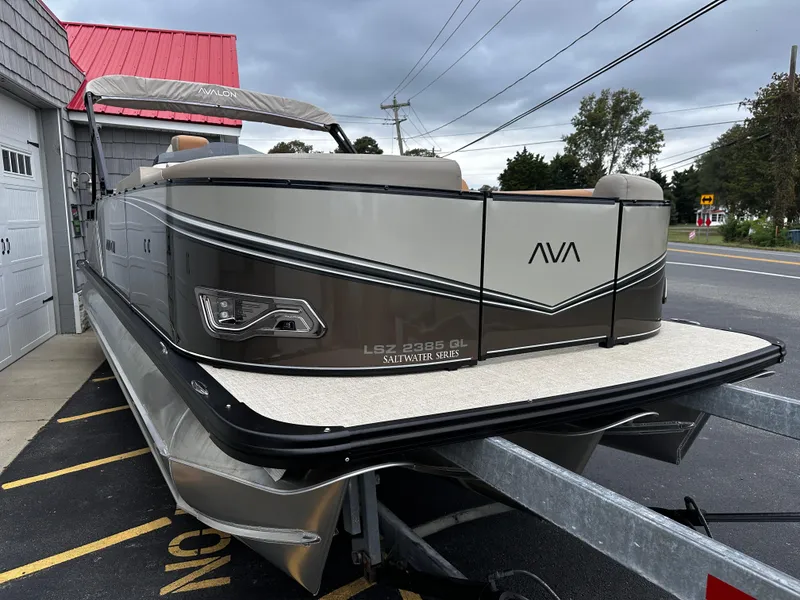 Slide: The Image of 2025 Avalon 2385 LSZ Quad Lounger Tri Toon on trailer, high-performance design. - 5