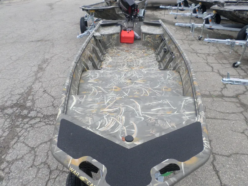 Slide: The Image of 2025 War Eagle 648 LDV boat with camouflage design on a trailer. - 2