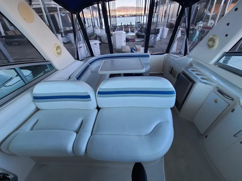 Slide: The Image of Interior of a 2002 Monterey 322 Cruiser with white and blue seating. - 14