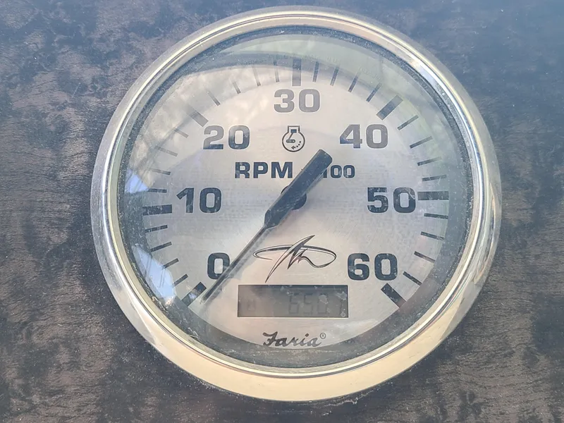 Slide: The Image of Close-up of a Faria tachometer on a 2002 Monterey 322 Cruiser boat. - 15