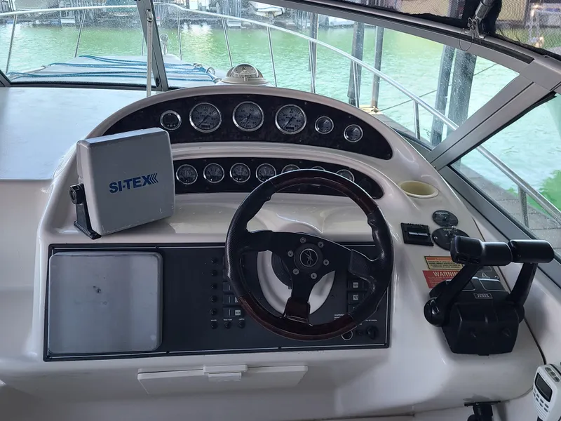 Slide: The Image of 2002 Monterey 322 Cruiser dashboard with steering wheel and navigation equipment. - 19