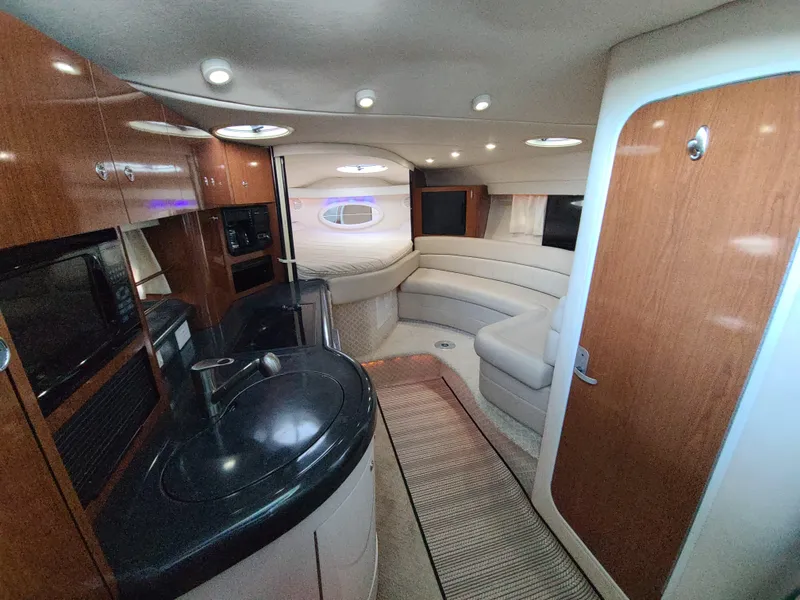 Slide: The Image of Interior of 2002 Monterey 322 Cruiser with modern kitchen and seating area. - 4