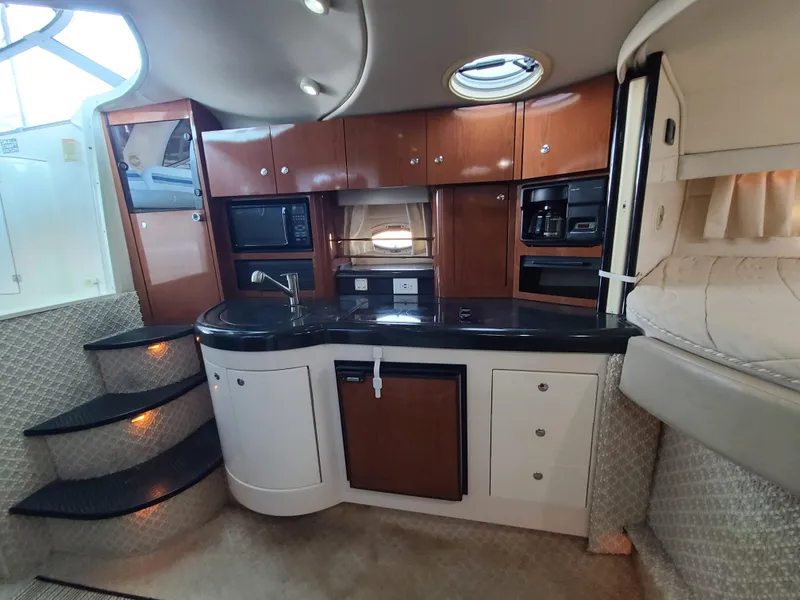Slide: The Image of Interior of 2002 Monterey 322 Cruiser with modern kitchen and sleek cabinetry. - 6