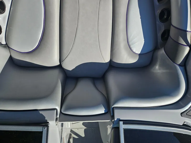 Slide: The Image of 2023 Sanger V215 LTZ boat interior with gray cushioned seating. - 15