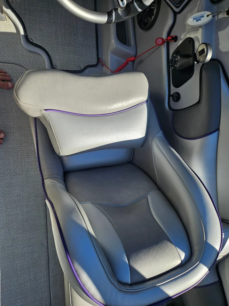 Slide: The Image of 2023 Sanger V215 LTZ boat interior with gray cushioned seat. - 22