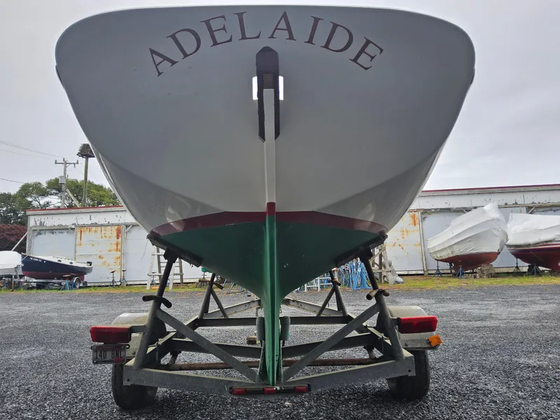 Slide: The Image of Herreshoff H-12 1/2 Gaff Rig sailboat, 2004, named Adelaide, on a trailer in a boatyard - 3