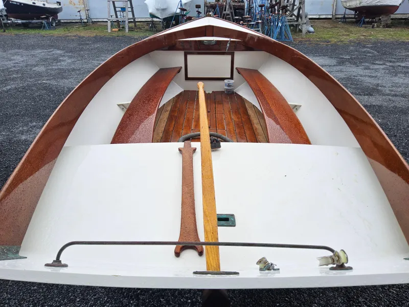 Slide: The Image of 2004 Herreshoff H-12 1/2 Gaff Rig sailboat interior with wooden details. - 4