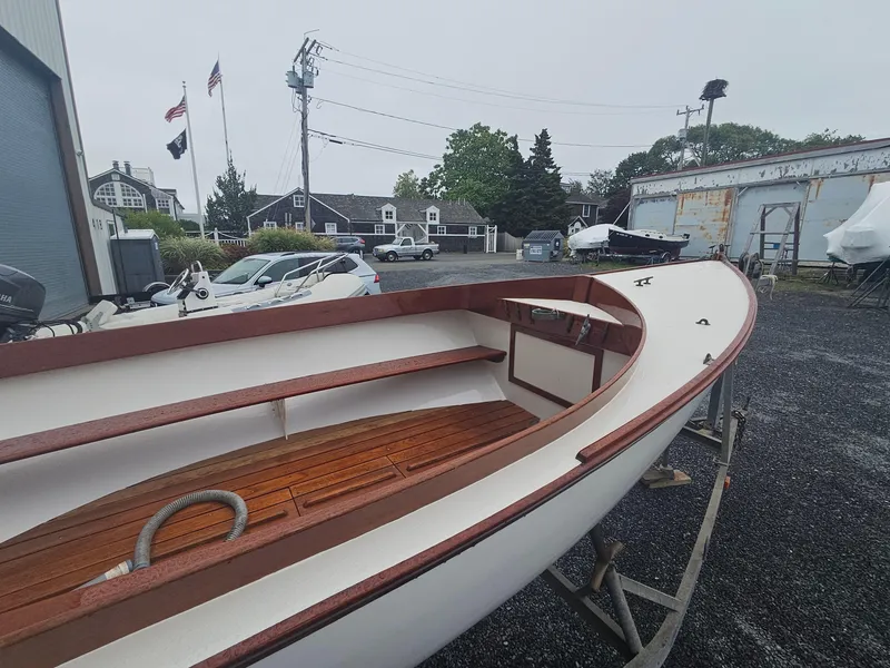 Slide: The Image of 2004 Herreshoff H-12 1/2 Gaff Rig sailboat on display in a boatyard. - 6