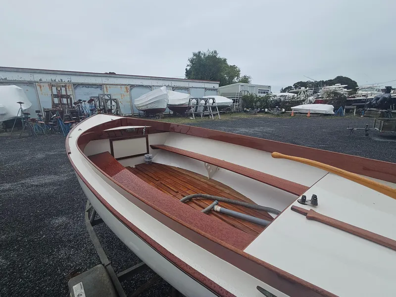Slide: The Image of 2004 Herreshoff H-12 1/2 Gaff Rig sailboat in a boatyard setting. - 8