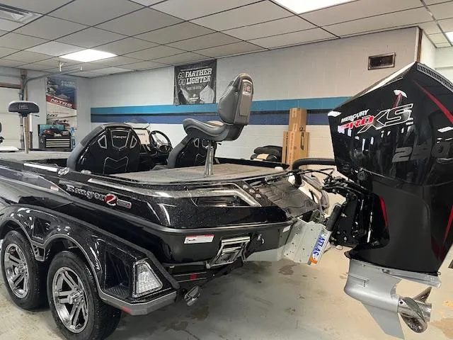 Slide: The Image of 2025 Ranger Z520R boat with powerful engine in showroom. - 6