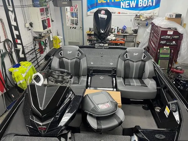 Slide: The Image of 2025 Ranger Z520R Ranger Cup Equipped boat interior with dual seats and steering console. - 8