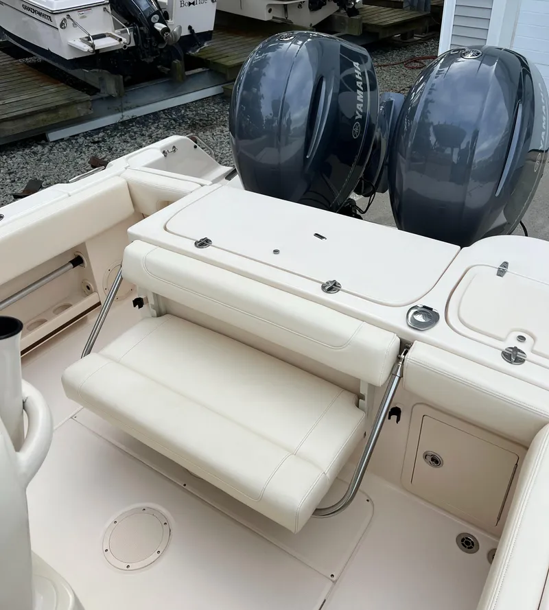 Slide: The Image of 2020 Grady-White 257 Fisherman boat with dual outboard engines and foldable seating. - 4