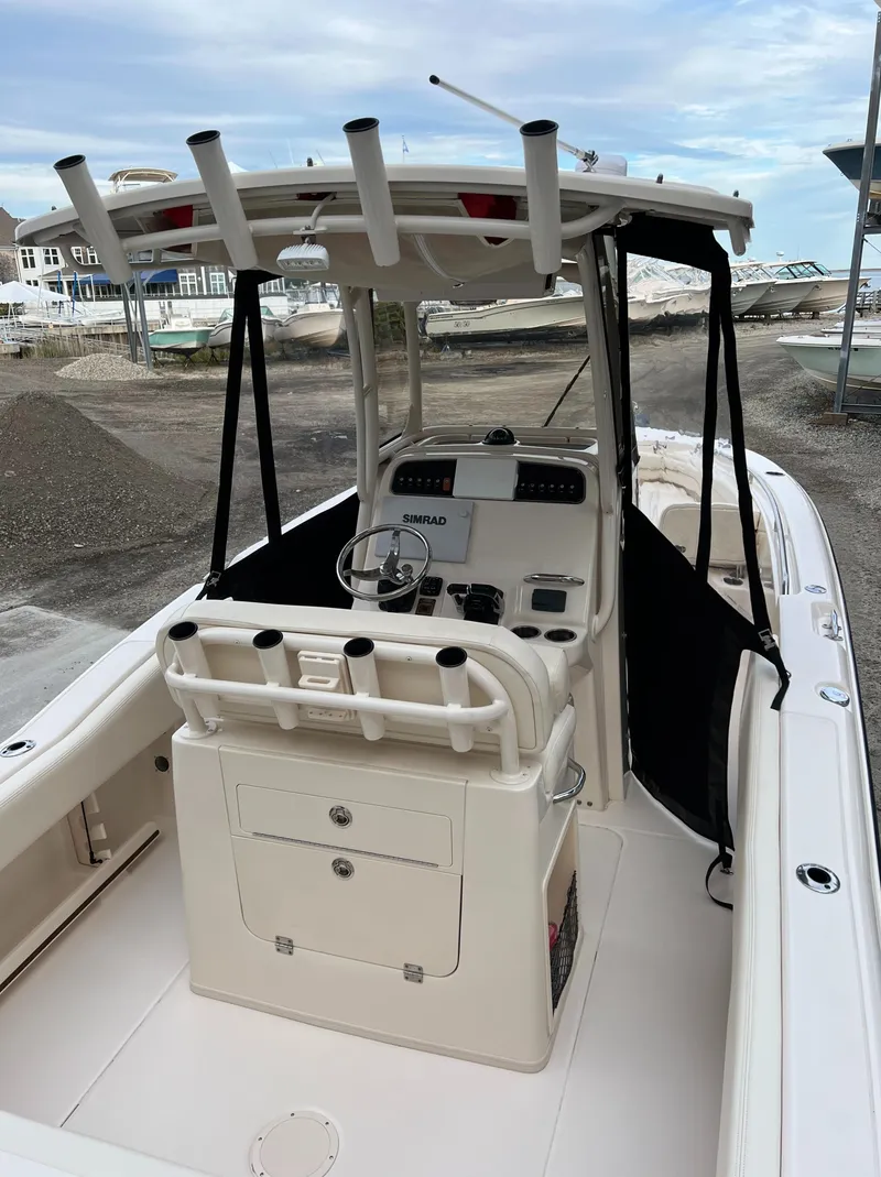 Slide: The Image of 2020 Grady-White 257 Fisherman boat interior with console and rod holders. - 5