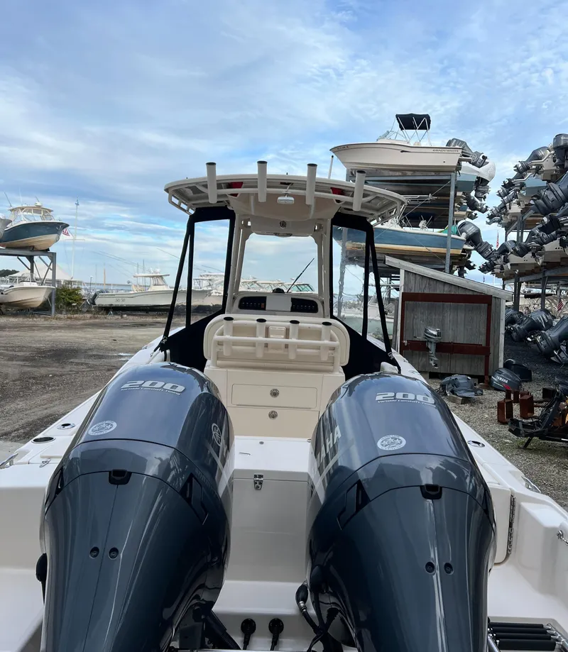 Slide: The Image of 2020 Grady-White 257 Fisherman boat with dual engines in a marina setting. - 6