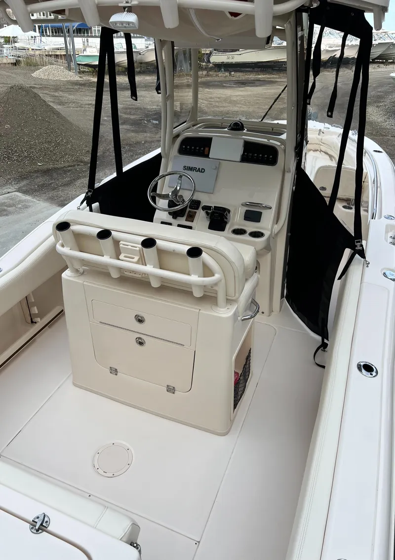 Slide: The Image of 2020 Grady-White 257 Fisherman boat interior with helm and seating area. - 7