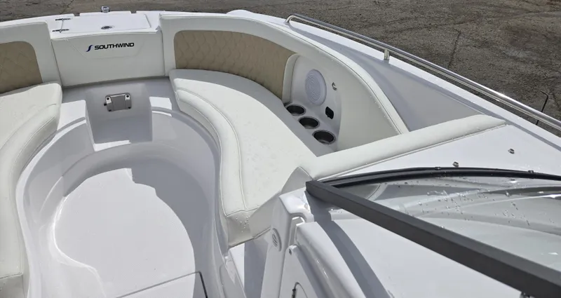 Slide: The Image of 2025 SouthWind 2200 SD boat interior with white seating and cup holders. - 13