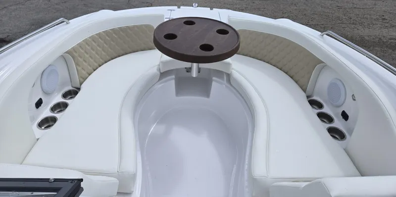 Slide: The Image of Luxurious seating area on 2025 SouthWind 2200 SD boat with table and cup holders. - 15