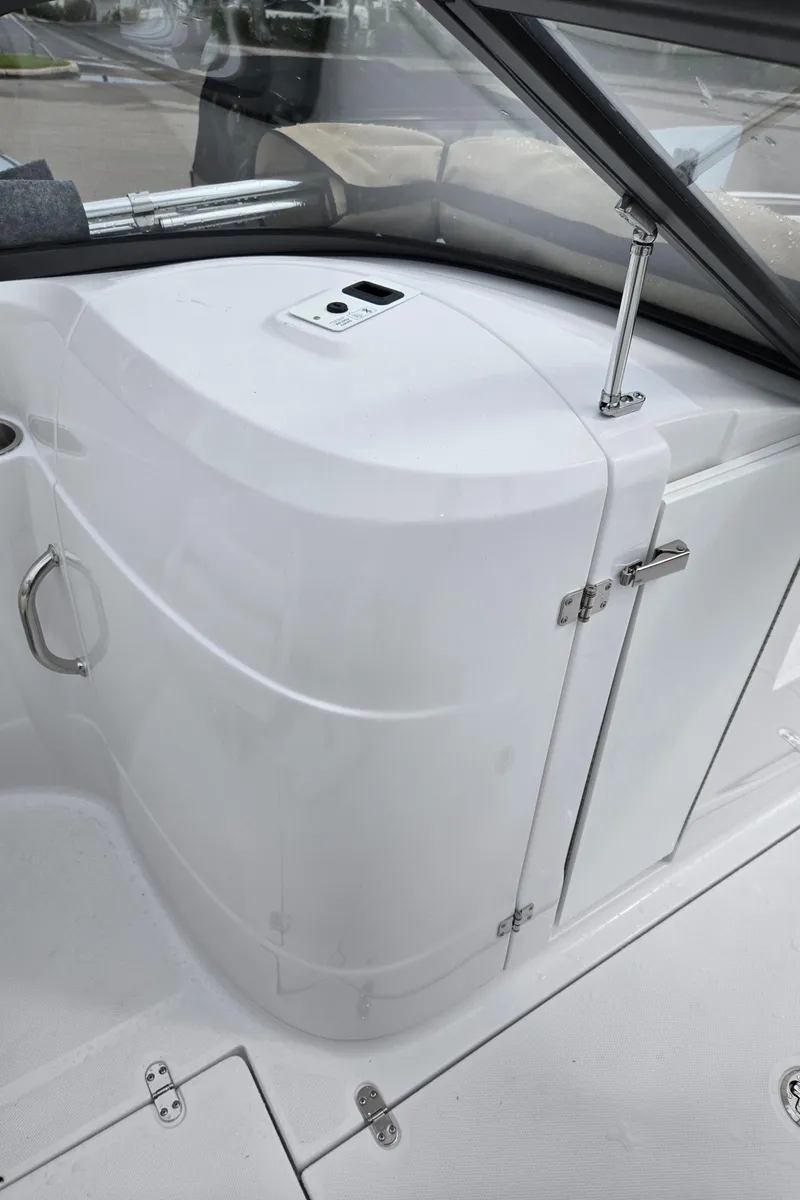 Slide: The Image of 2025 SouthWind 2200 SD boat interior, featuring sleek white design and modern fixtures. - 18