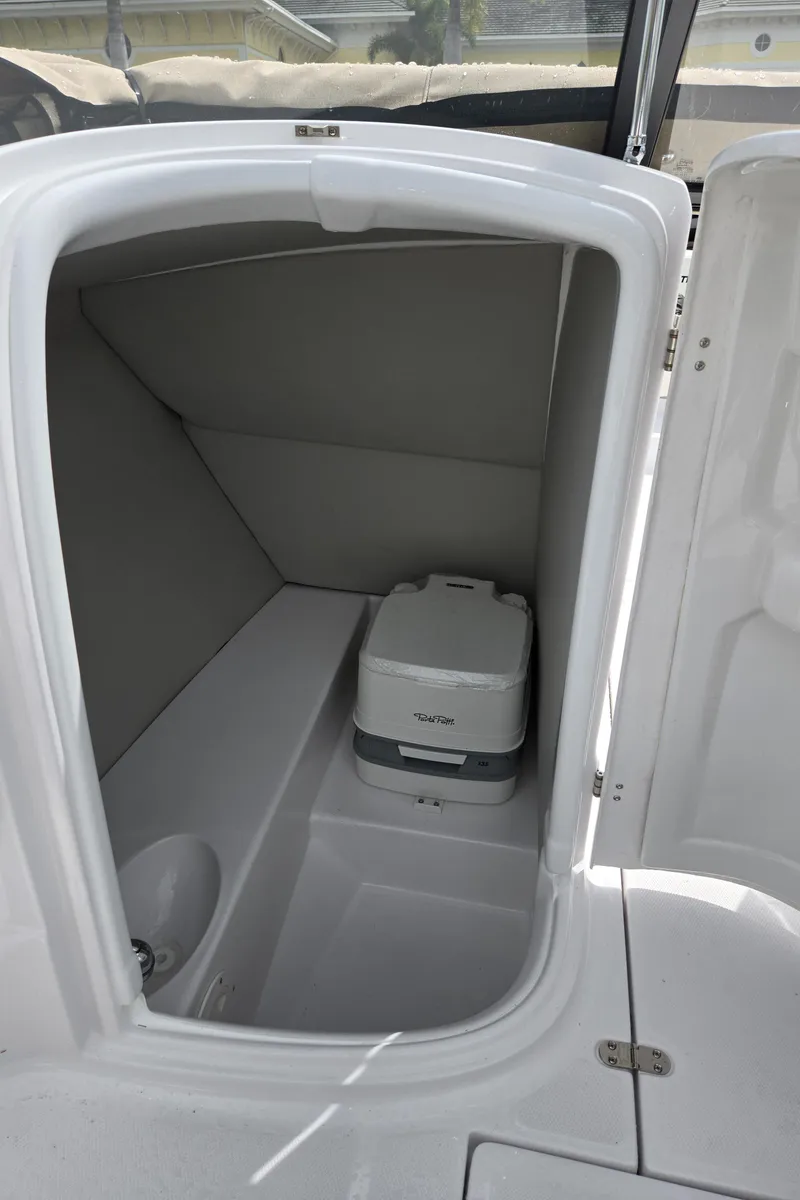 Slide: The Image of 2025 SouthWind 2200 SD boat interior with compact marine toilet. - 19