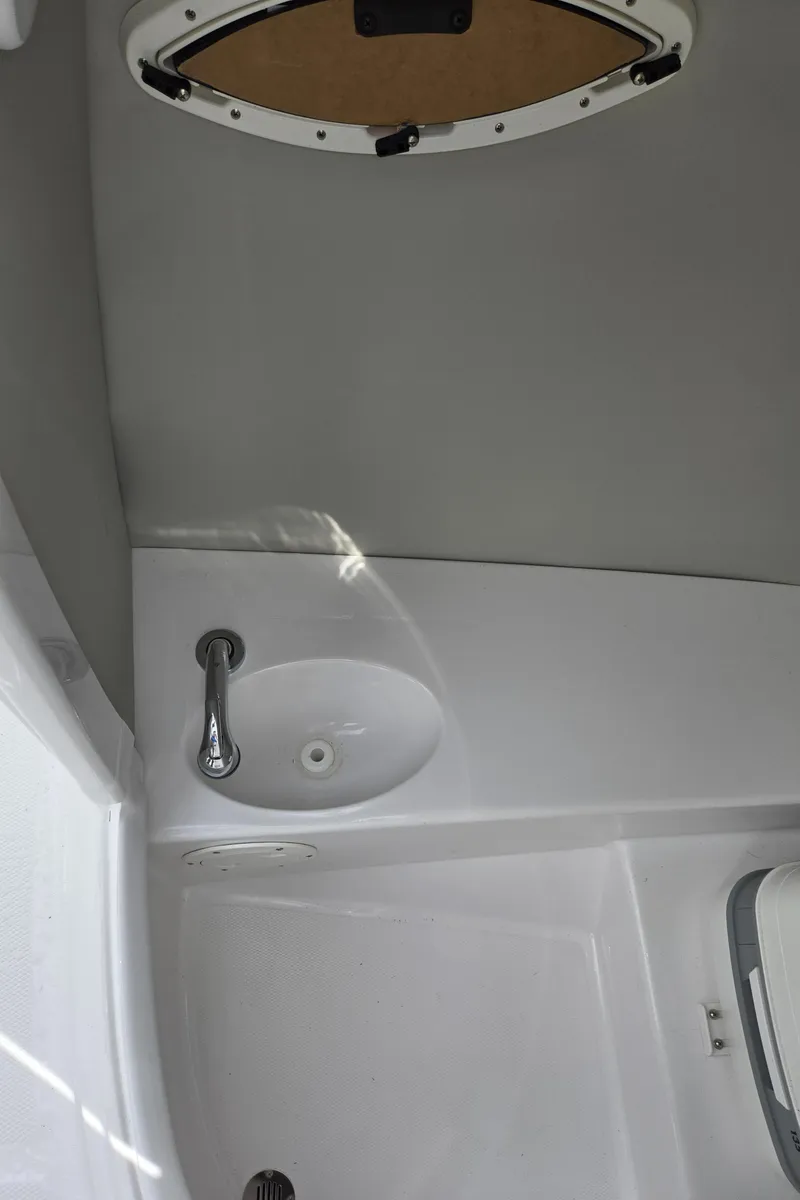 Slide: The Image of Interior of 2025 SouthWind 2200 SD boat, featuring a compact sink and hatch. - 20