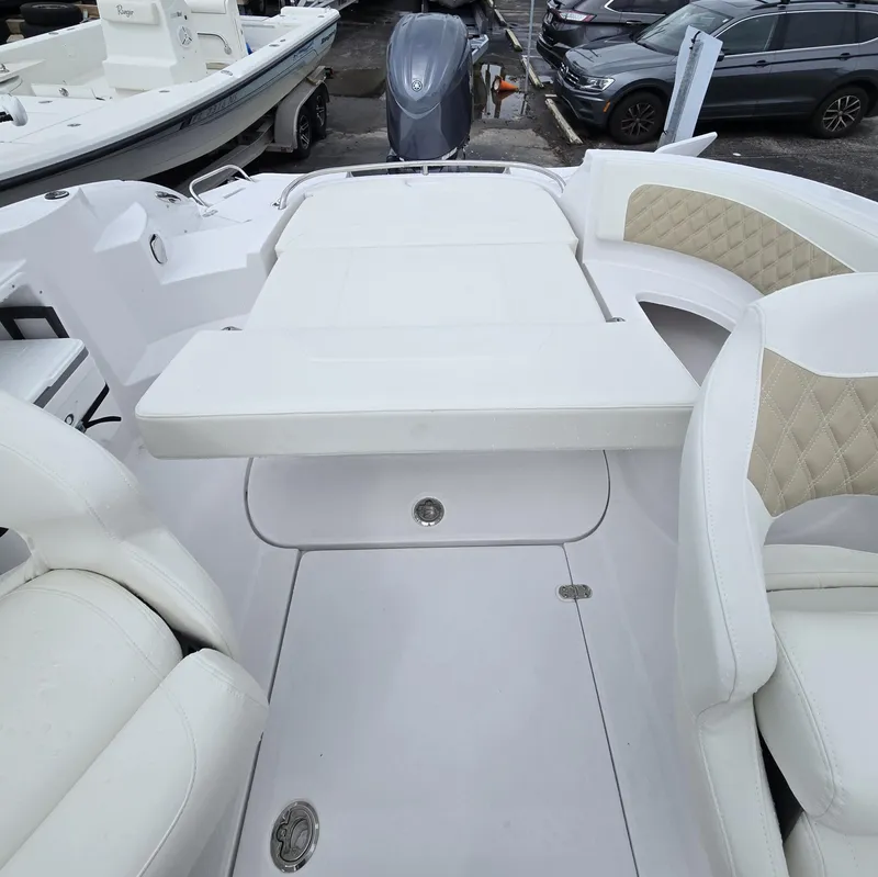 Slide: The Image of 2025 SouthWind 2200 SD boat interior with white seating and spacious layout. - 21