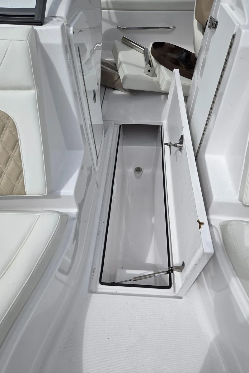 Slide: The Image of 2025 SouthWind 2200 SD boat interior storage compartment with open hatch. - 23