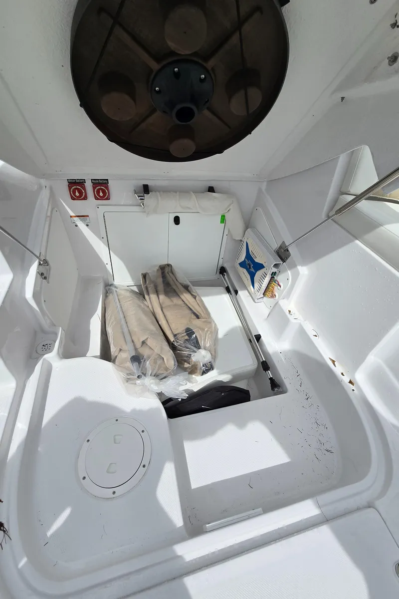 Slide: The Image of 2025 SouthWind 2200 SD boat storage compartment with fins and equipment. - 29