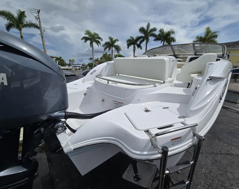 Slide: The Image of 2025 SouthWind 2200 SD boat with Yamaha engine, parked under palm trees. - 3