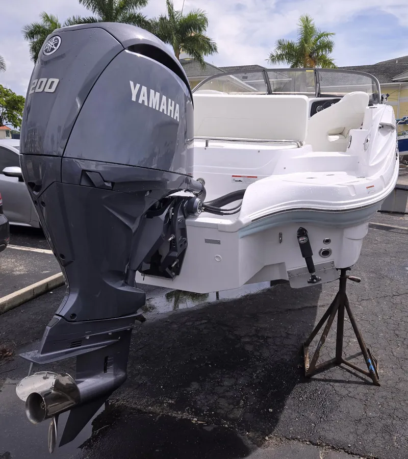 Slide: The Image of 2025 SouthWind 2200 SD boat with Yamaha 200 engine, parked outdoors. - 4