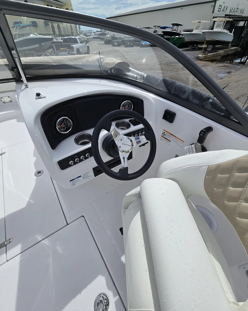 Slide: The Image of 2025 SouthWind 2200 SD boat cockpit with steering wheel and dashboard controls. - 9