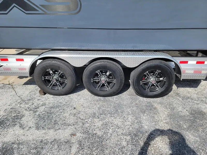 Slide: The Image of Trailer with three wheels for 2026 Shallow Sport 32 X3 boat. - 10