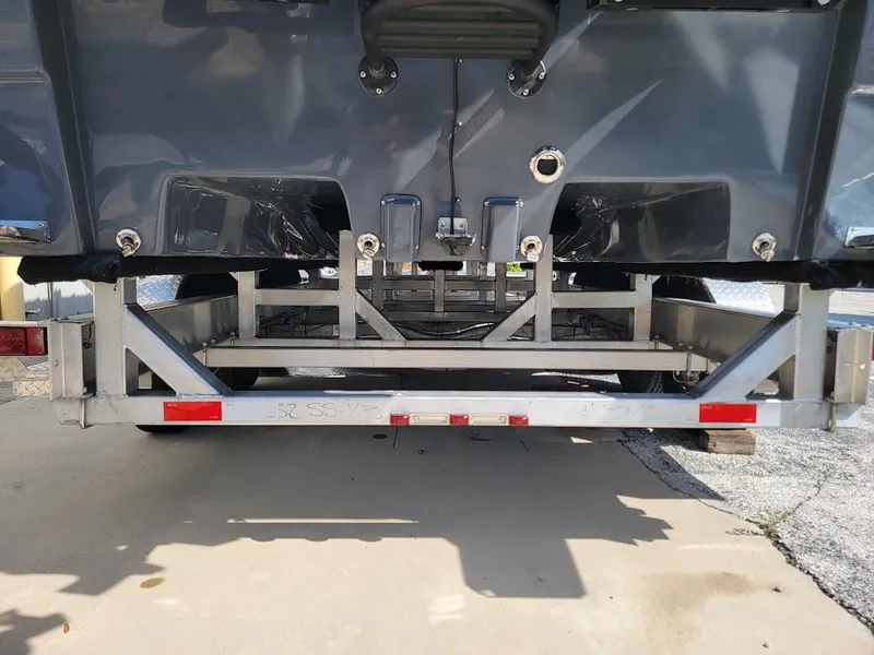 Slide: The Image of Rear view of 2026 Shallow Sport 32 X3 boat on a trailer. - 11