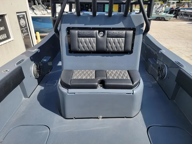 Slide: The Image of 2026 Shallow Sport 32 X3 boat interior with cushioned seating and sleek design. - 12