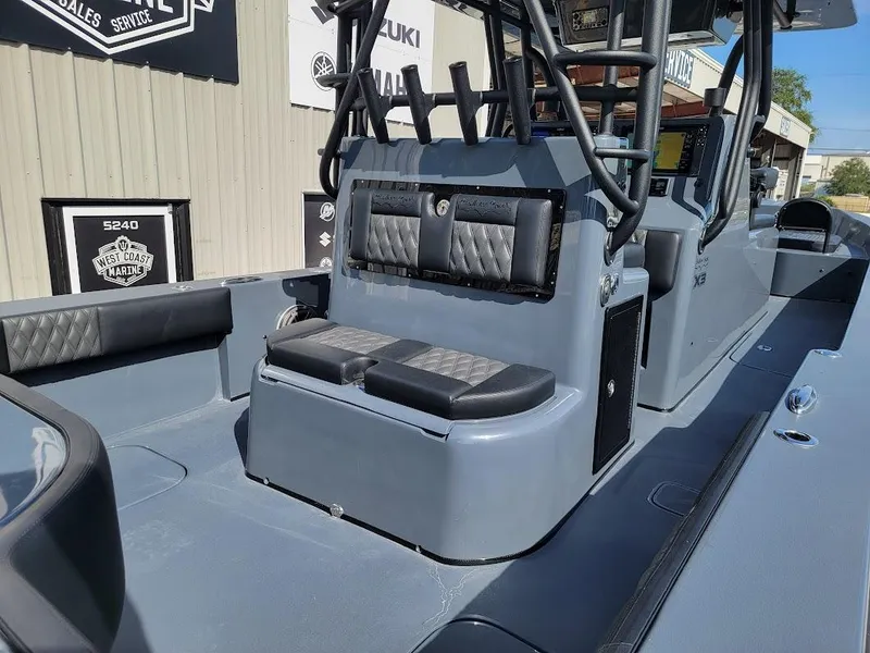 Slide: The Image of 2026 Shallow Sport 32 X3 boat interior with sleek seating and modern design. - 13