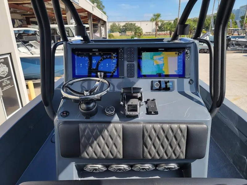 Slide: The Image of 2026 Shallow Sport 32 X3 boat dashboard with advanced navigation displays and controls. - 16