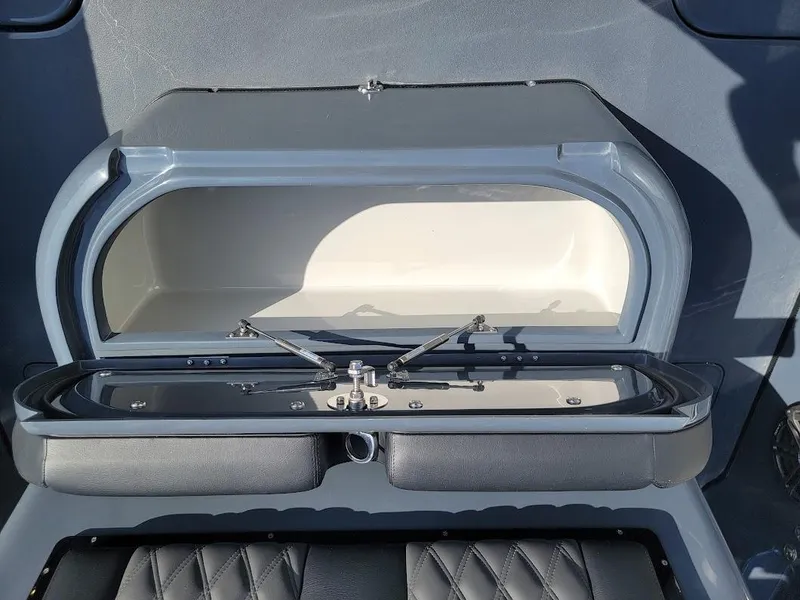 Slide: The Image of Open storage compartment on 2026 Shallow Sport 32 X3 boat, featuring sleek design and modern functionality. - 17