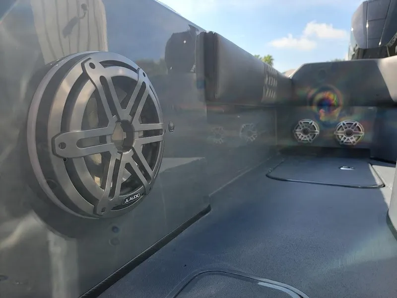 Slide: The Image of 2026 Shallow Sport 32 X3 boat interior with premium speakers and sleek design. - 22