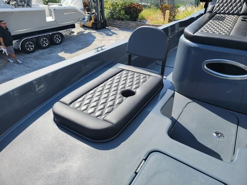 Slide: The Image of Shallow Sport 32 X3 boat interior with diamond-stitched seating, 2026 model. - 27