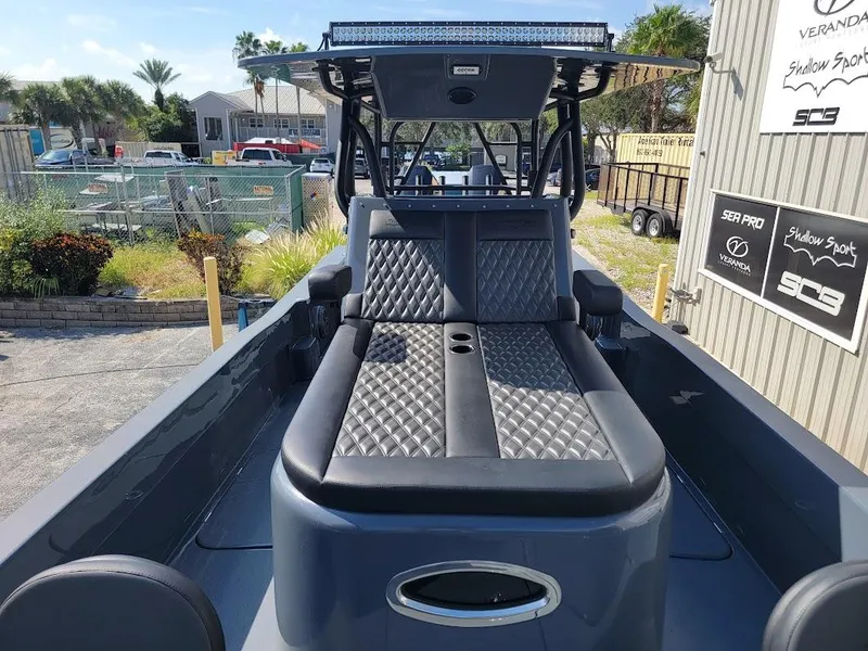 Slide: The Image of 2026 Shallow Sport 32 X3 boat with sleek seating and modern design. - 32