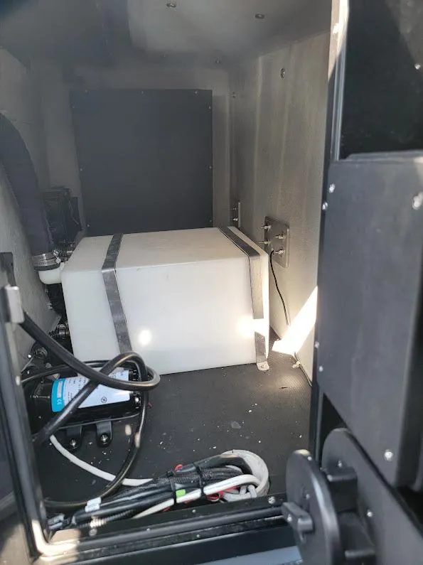 Slide: The Image of Interior view of 2026 Shallow Sport 32 X3 boat compartment with equipment. - 37