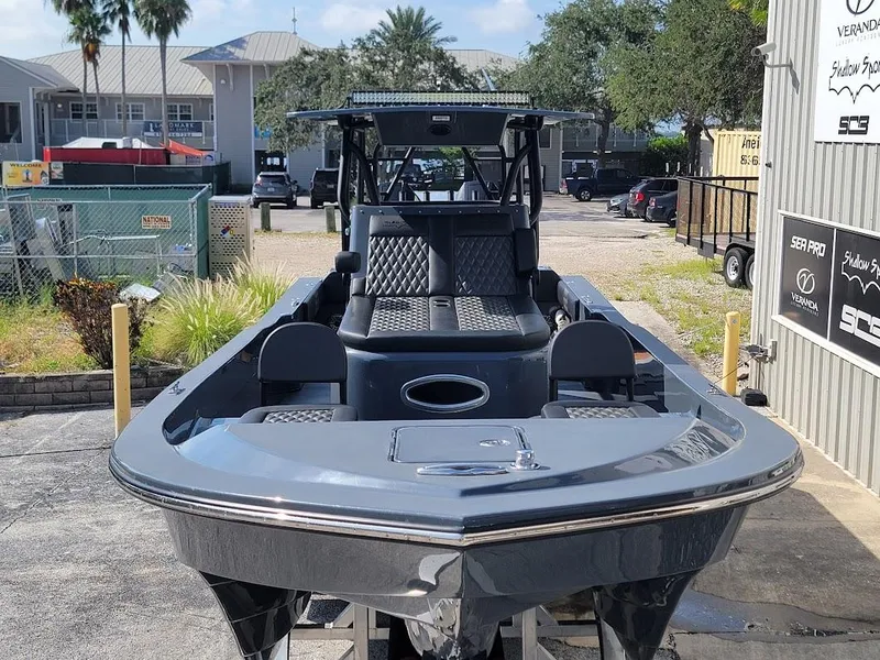 Slide: The Image of 2026 Shallow Sport 32 X3 boat in a marina setting, showcasing sleek design and modern features. - 4